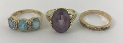 Lot 301 - Three gold coloured metal gem-set rings