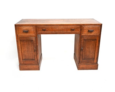 Lot 392 - A Cotswold School, Arts and Crafts oak desk,...