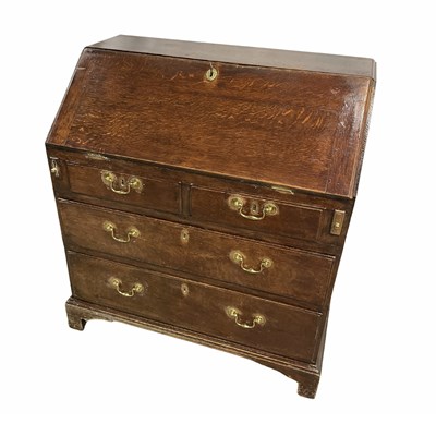 Lot 369 - A late 18th or early 19th century oak bureau,...