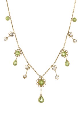 Lot 3 - An Edwardian 15ct gold peridot and seed pearl floral fringe necklace