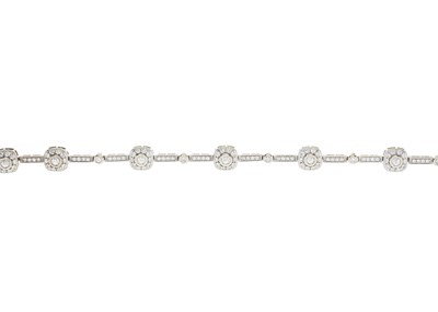 Lot 214 - A 14ct gold diamond cluster line bracelet