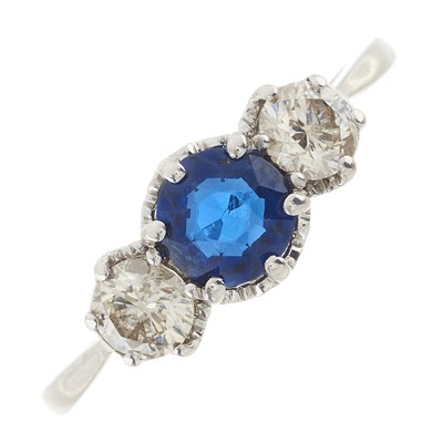 Lot 228 - An 18ct gold sapphire and diamond three-stone ring