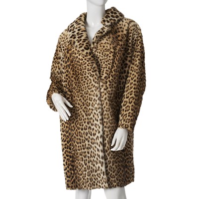 Lot 574 - A 1960s knee-length leopard fur coat