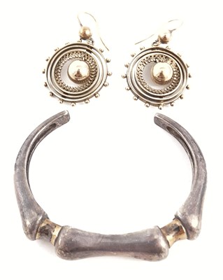 Lot 283 - An 18ct gold and silver cuff bangle, and a pair of Etruscan Revival drop earrings