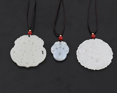 Lot 366 - Three Chinese carved pendants including jade...