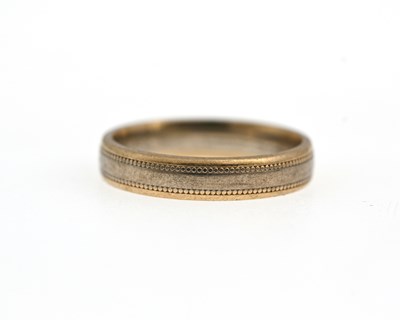 Lot 2 - A 9 carat gold bi colour wedding band ring,...