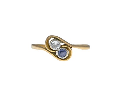 Lot 11 - An 18 carat gold diamond and sapphire...