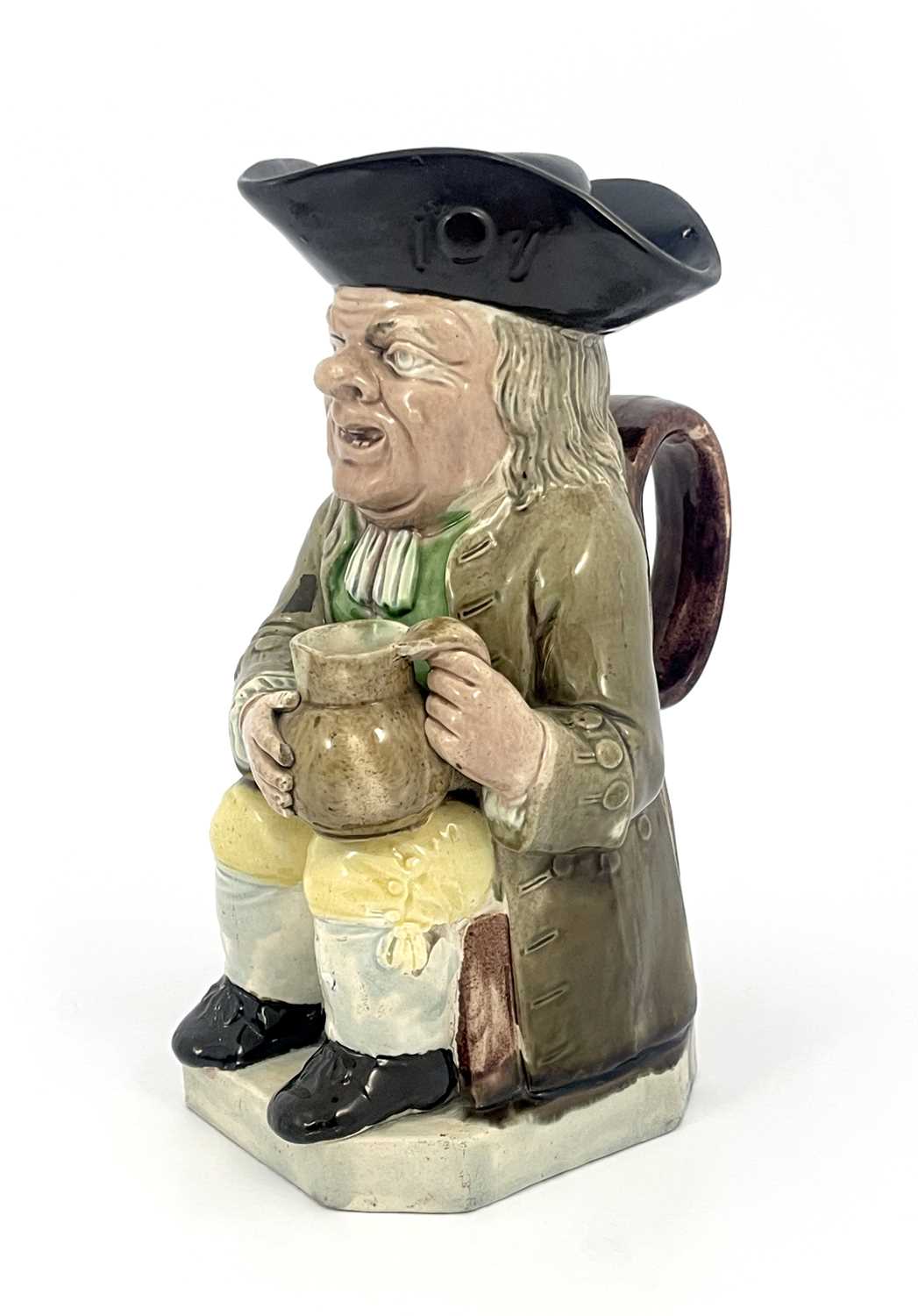 Lot 1046 - A Staffordshire Toby jug and beaker lid, Ralph...