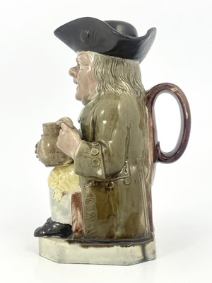 Lot 1046 - A Staffordshire Toby jug and beaker lid, Ralph...