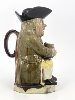 Lot 1046 - A Staffordshire Toby jug and beaker lid, Ralph...