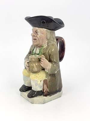 Lot 1046 - A Staffordshire Toby jug and beaker lid, Ralph...