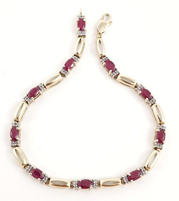 Lot 291 - A 9ct gold ruby and diamond line bracelet