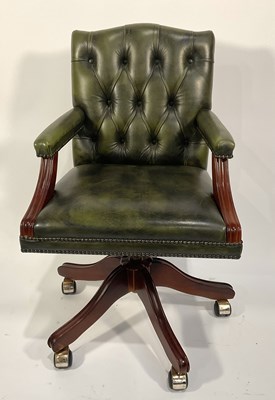 Lot 357 - A captain's swivel chair, modern, green button...