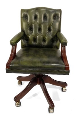 Lot 357 - A captain's swivel chair, modern, green button...