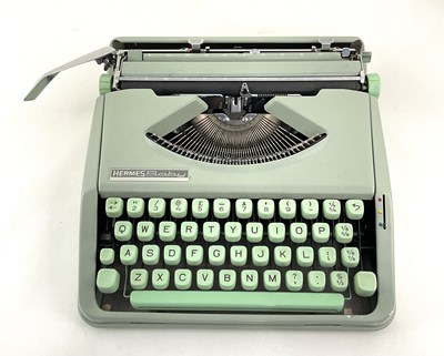 Lot 223 - A Hermes Baby typewriter in mint green with...