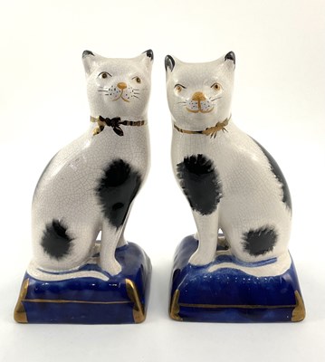 Lot 100 - Beswick: A pair of small Staffordshire cats on...