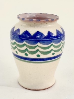 Lot 148 - A small Poole pottery vase, painted blue and...