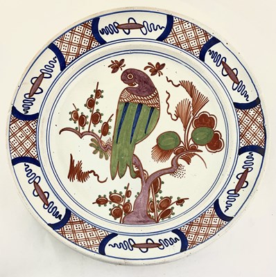 Lot 162 - A Dutch Delft polychrome dish, depicting a...