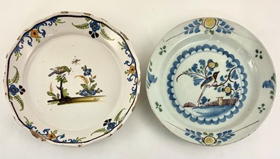 Lot 165 - Two French faience plates, painted with birds...