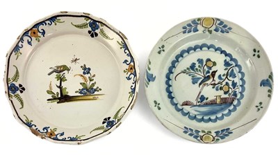 Lot 165 - Two French faience plates, painted with birds...