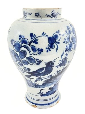 Lot 163 - A Dutch Delft baluster vase, decorated in...