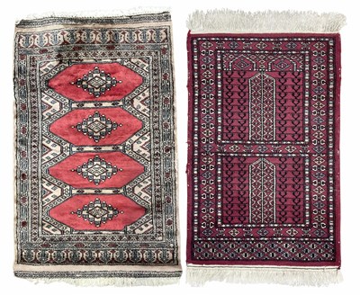 Lot 342 - A wool prayer rug, red on grey ground with...