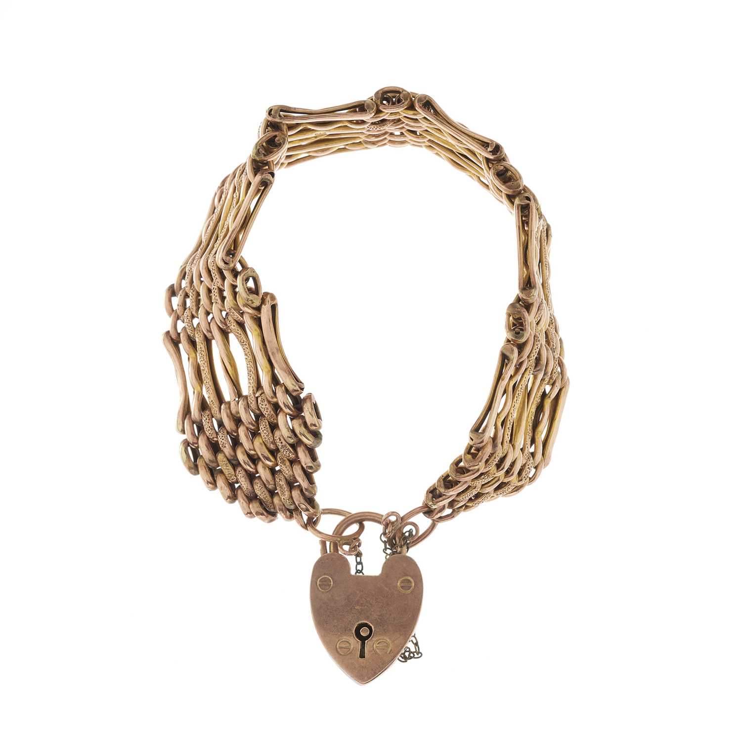 Lot 2 - An early 20th century 9ct gold gate bracelet,...