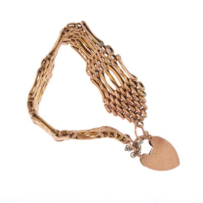 Lot 2 - An early 20th century 9ct gold gate bracelet,...