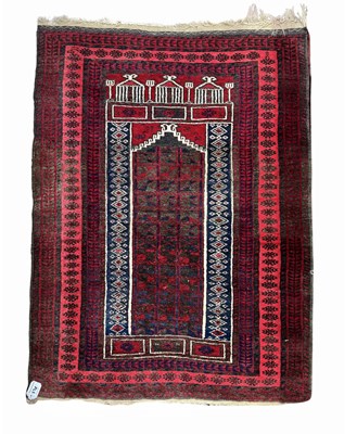 Lot 338 - An Afghan Baluch style wool prayer rug in red,...