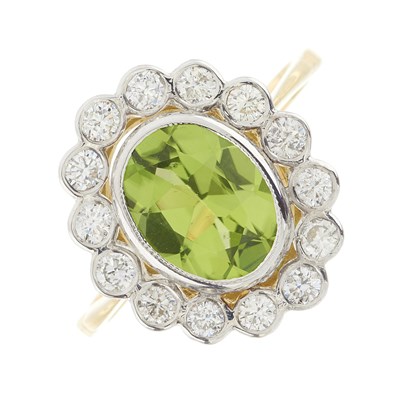 Lot 60 - An 18ct gold peridot and diamond cluster ring