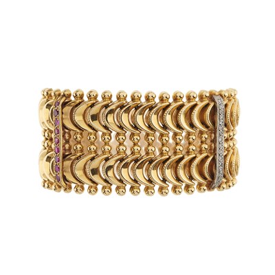 Lot 85 - An 18ct gold ruby and diamond articulated bracelet