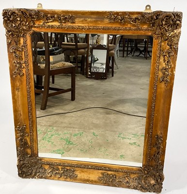 Lot 421 - A large rectangular gilt Rococo style mirror,...