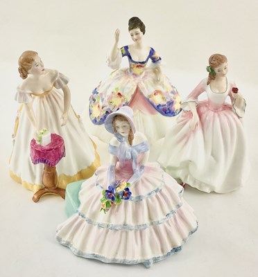 Lot 105 - A collection of Royal Doulton figurines,...