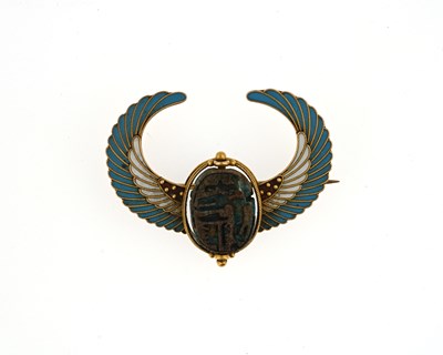 Lot 46 - An Egyptian Revivalist gold coloured metal and...