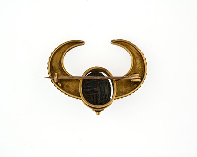 Lot 46 - An Egyptian Revivalist gold coloured metal and...