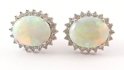 Lot 275 - A pair of 18ct gold opal and diamond cluster stud earrings