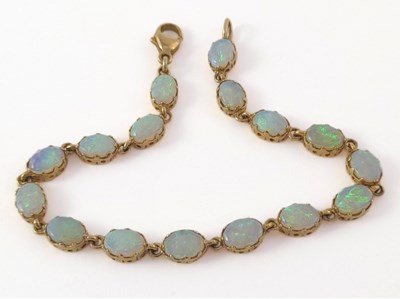 Lot 289 - A 9ct gold opal line bracelet