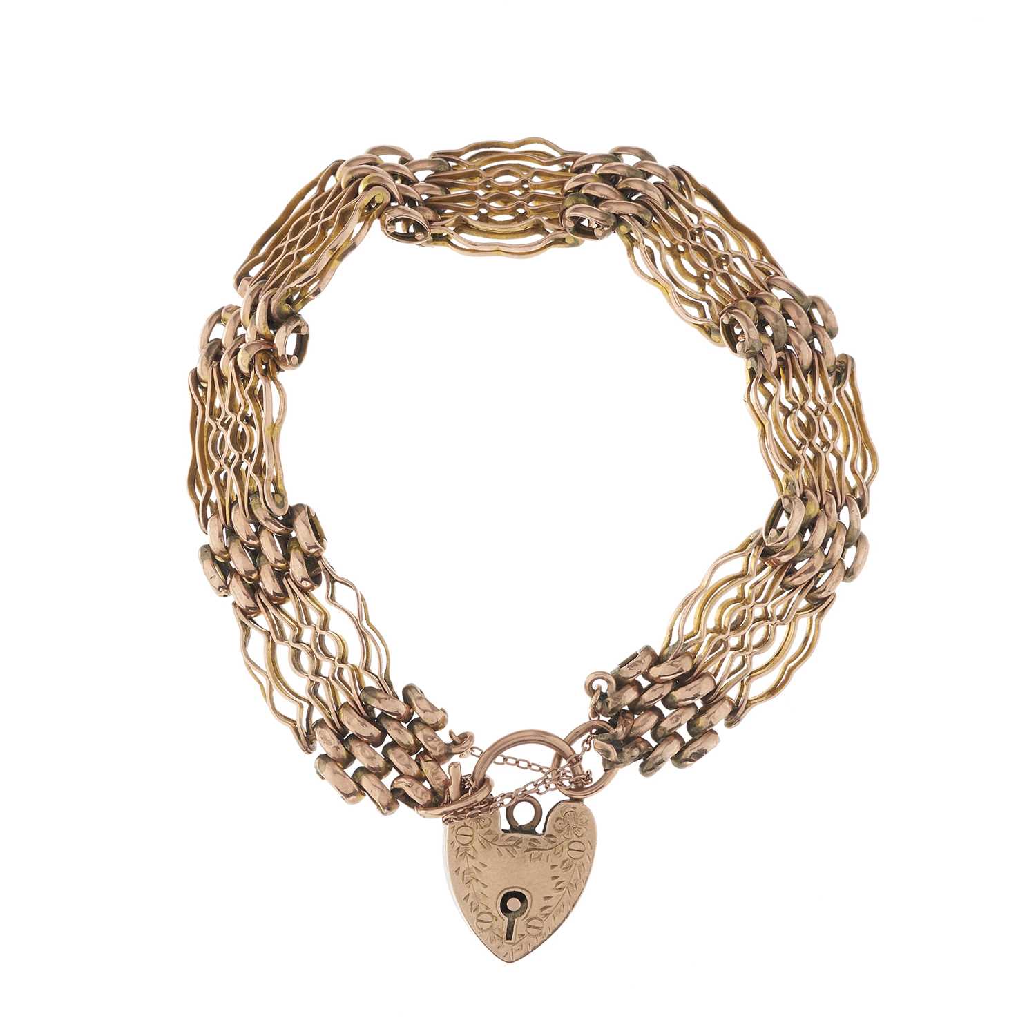 Lot 12 - An early 20th century 9ct gold gate bracelet,...