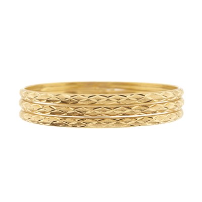 Lot 78 - Three high carat gold bangle bracelets