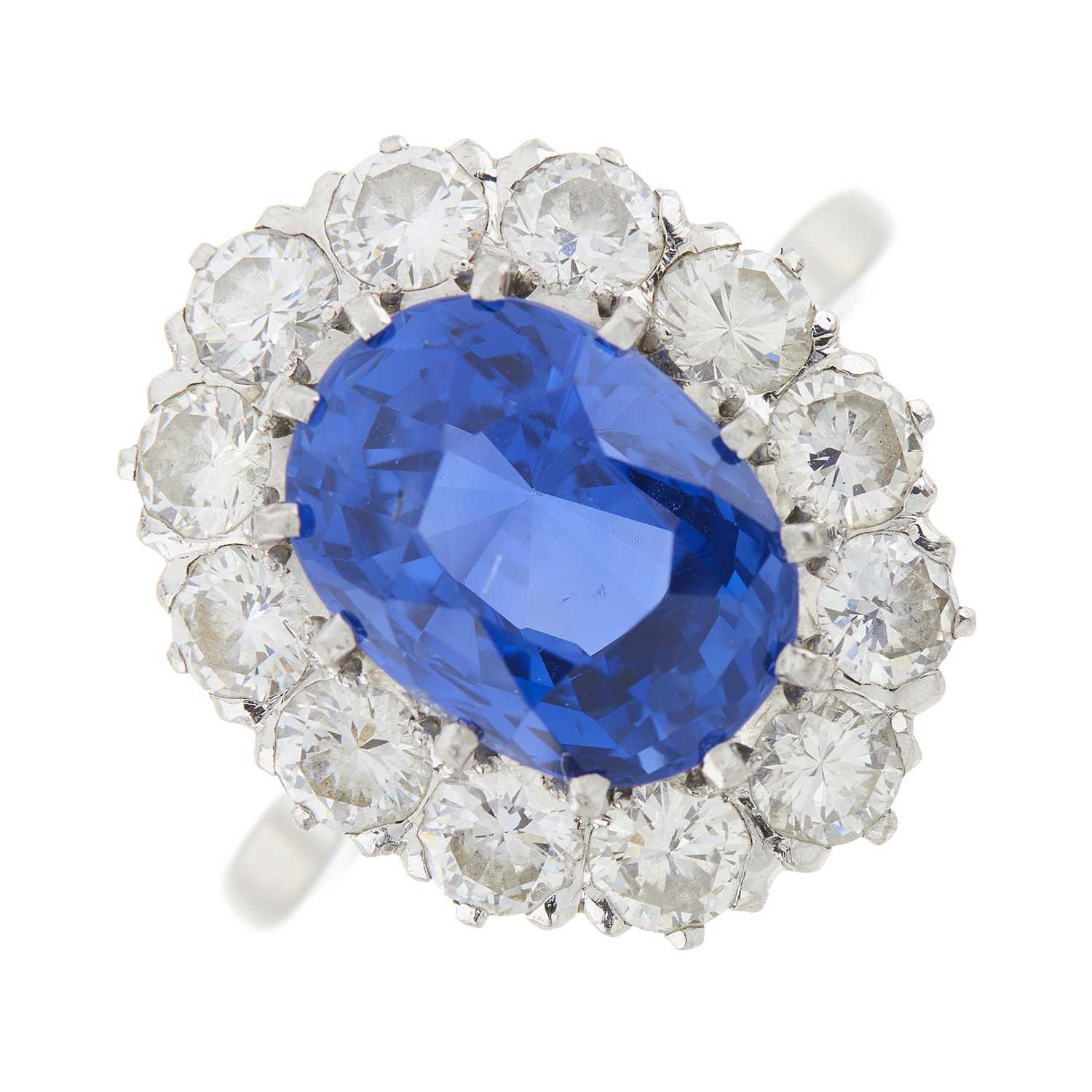 Lot 92 - An 18ct gold and platinum unheated Sri Lankan sapphire and diamond cluster ring