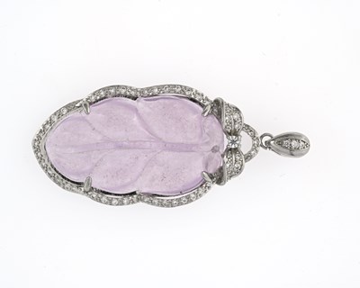 Lot 1 - A Chinese lavender jade and white stone...