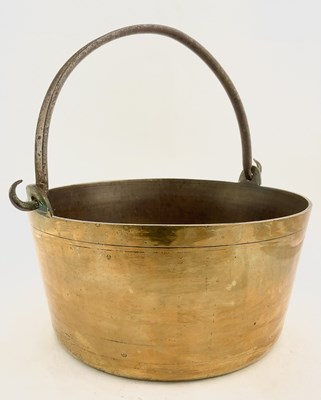 Lot 205 - A large Victorian brass jam pan with swing...