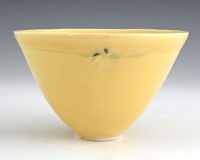 Lot 644 - A studio pottery bowl, yellow glazed conical...