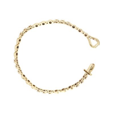 Lot 59 - An 18ct gold diamond line bracelet