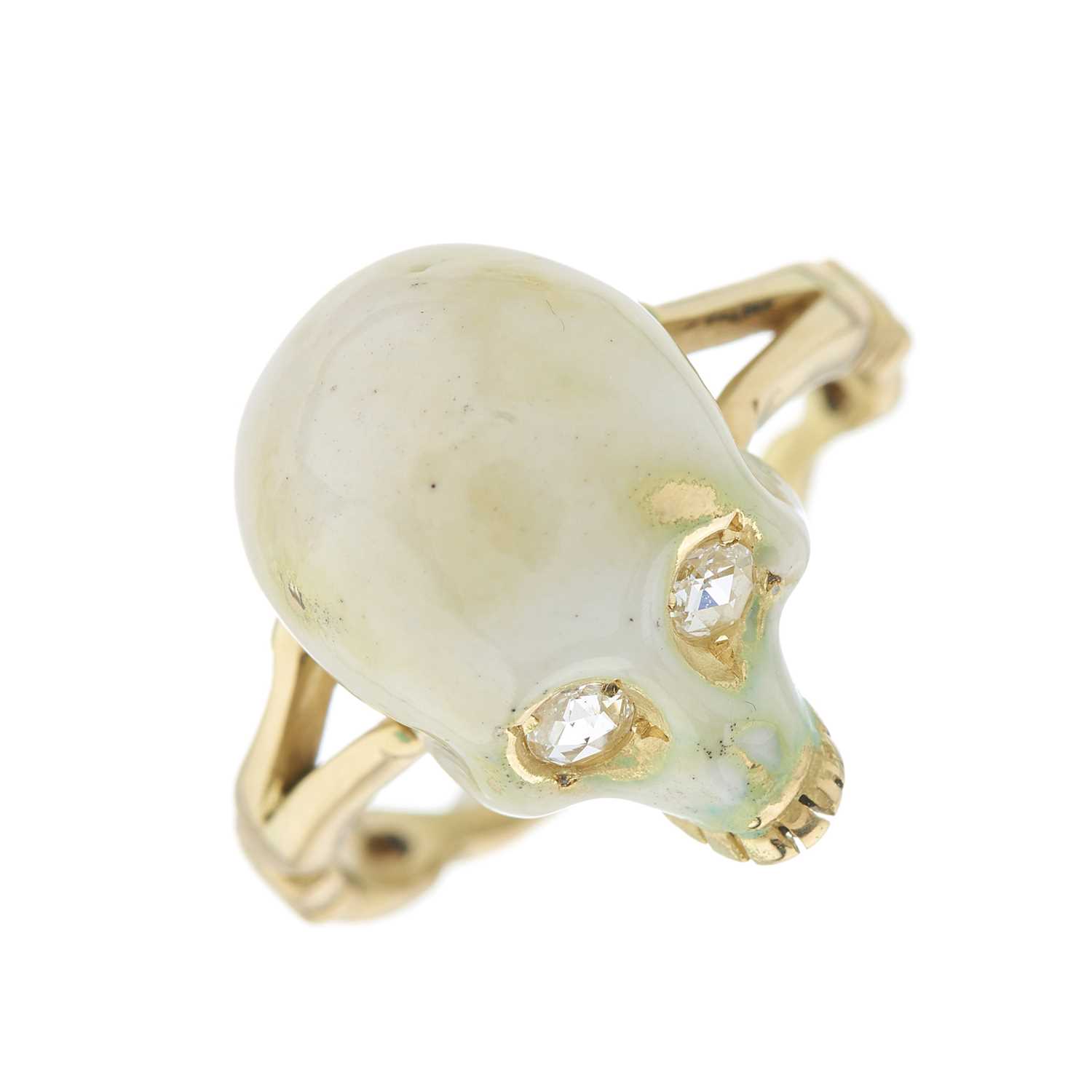 Lot 42 - An 18ct gold white enamel skull ring, with...