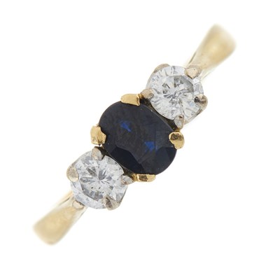 Lot 244 - An 18ct gold sapphire and diamond three-stone ring