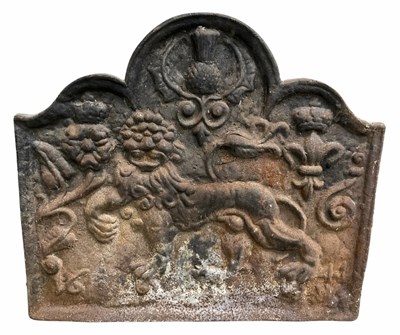 Lot 231 - A large cast iron fireback, cast in high...