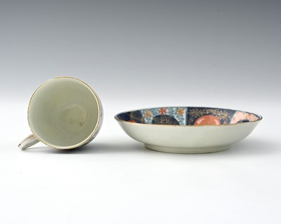 Lot 669 - A Worcester polychrome coffee cup and saucer,...