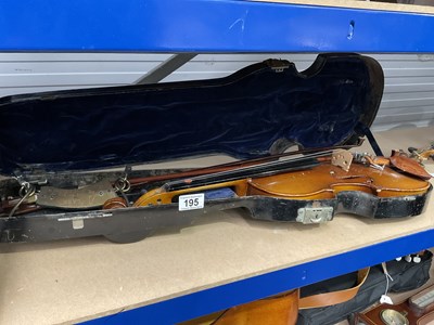 Lot 195 - A violin with two bows in a fitted metal case