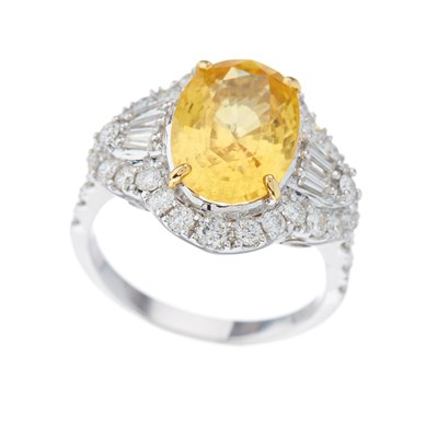 Lot 56 - An 18ct gold yellow sapphire and diamond...